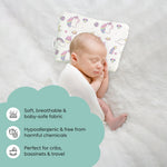 Sleeping baby using ADMIRAE Head Shaping Baby Pillow with unicorn design on soft white surface