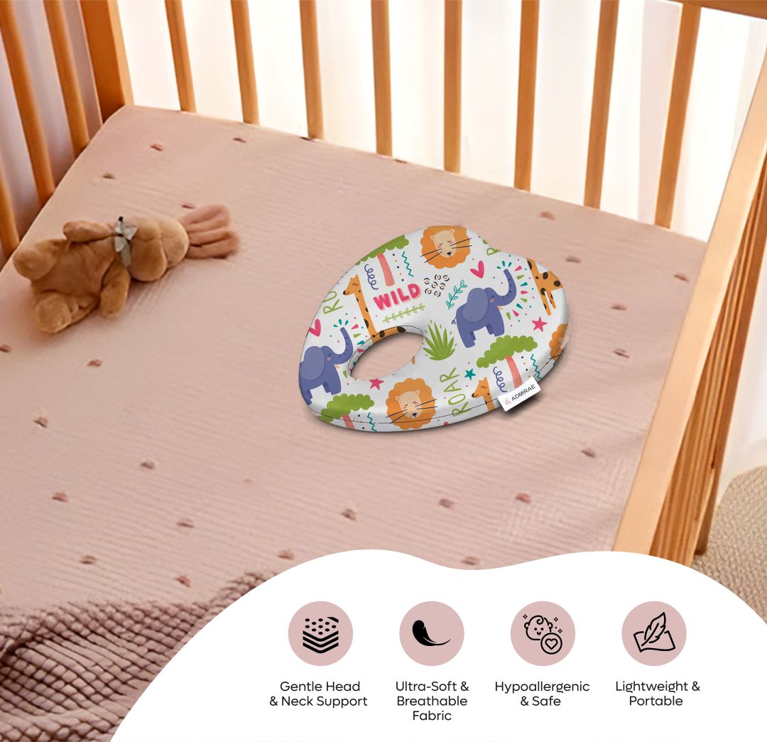 ADMIRAE Head shaping heart Baby Pillow with colorful animal print on pink crib mattress for gentle head and neck support