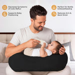 ADMIRAE black baby feeding pillow supporting a baby during bottle feeding to reduce arm and back strain