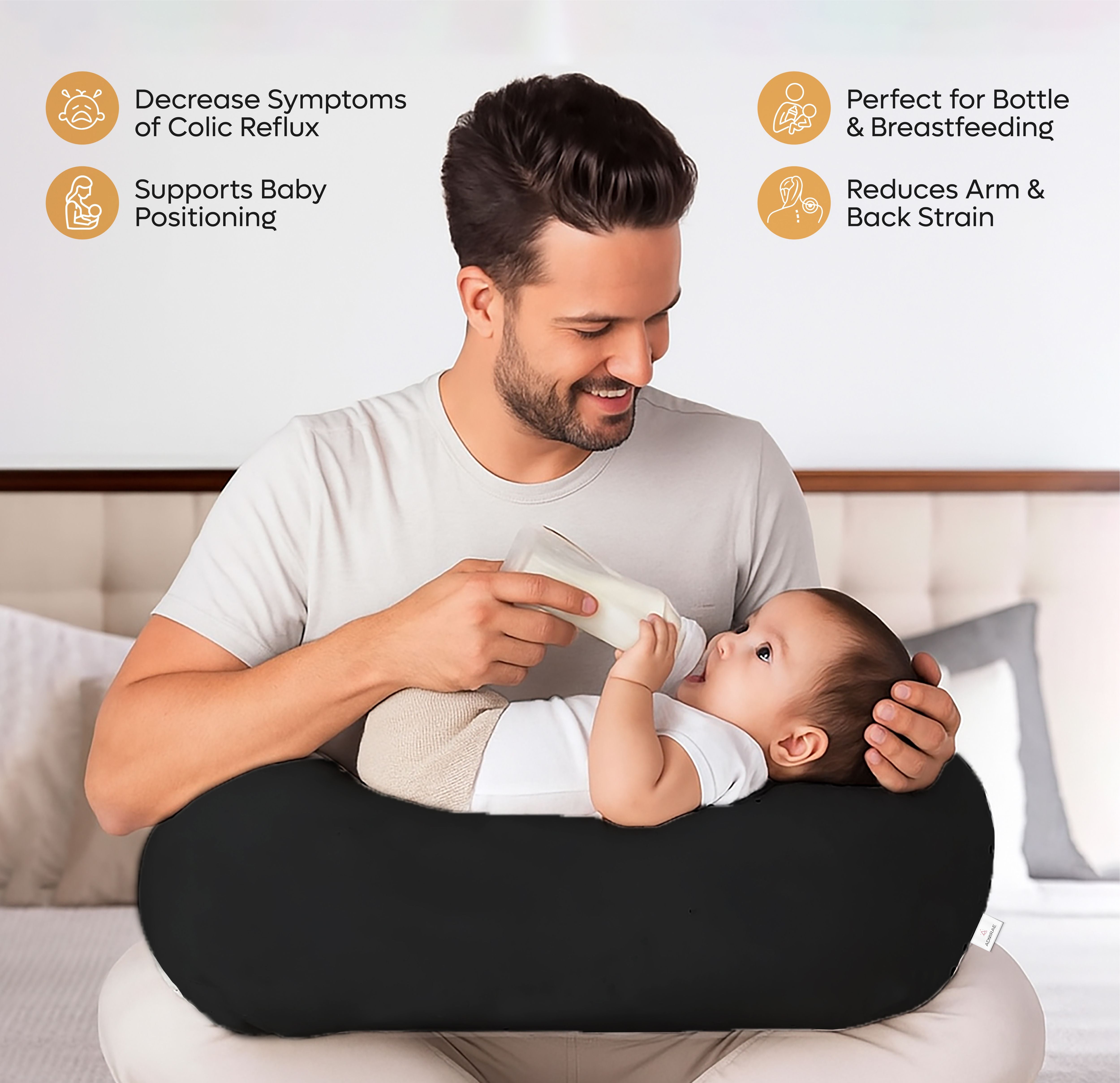 ADMIRAE black baby feeding pillow supporting a baby during bottle feeding to reduce arm and back strain