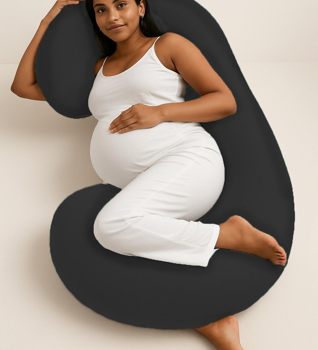 ADMIRAE black C shape pregnancy pillow supporting pregnant woman lying on side