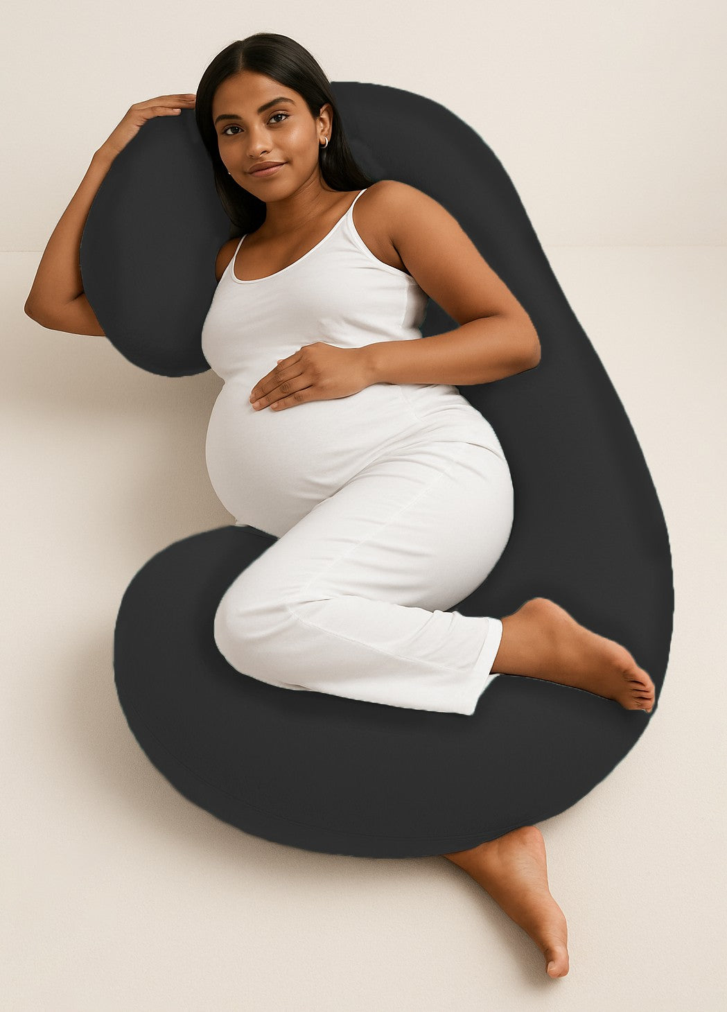 ADMIRAE black C shape pregnancy pillow supporting pregnant woman lying on side
