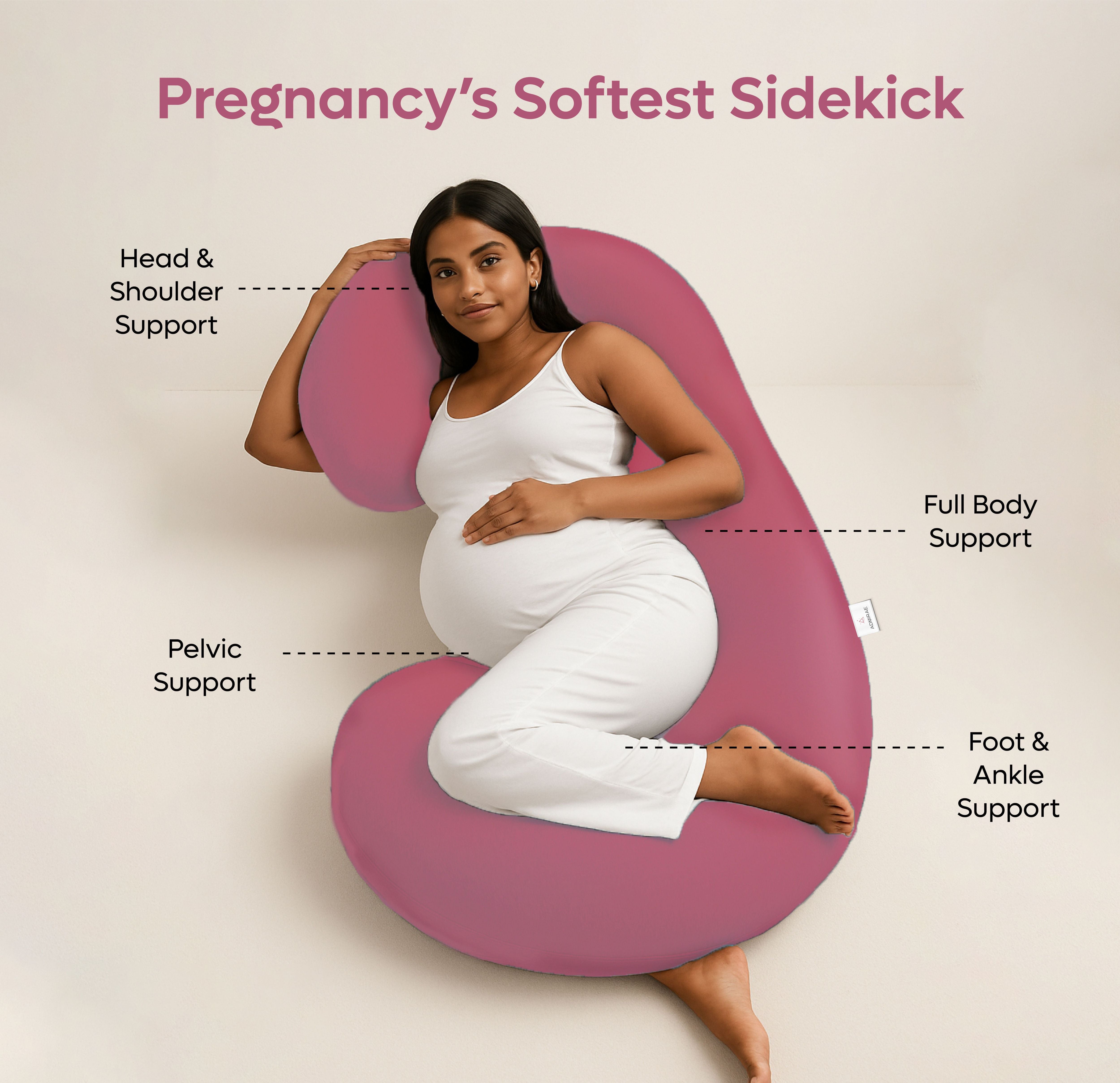 Pregnant woman using Admirae C shape pregnancy pillow in pink for full body, head, pelvic, foot, and ankle support