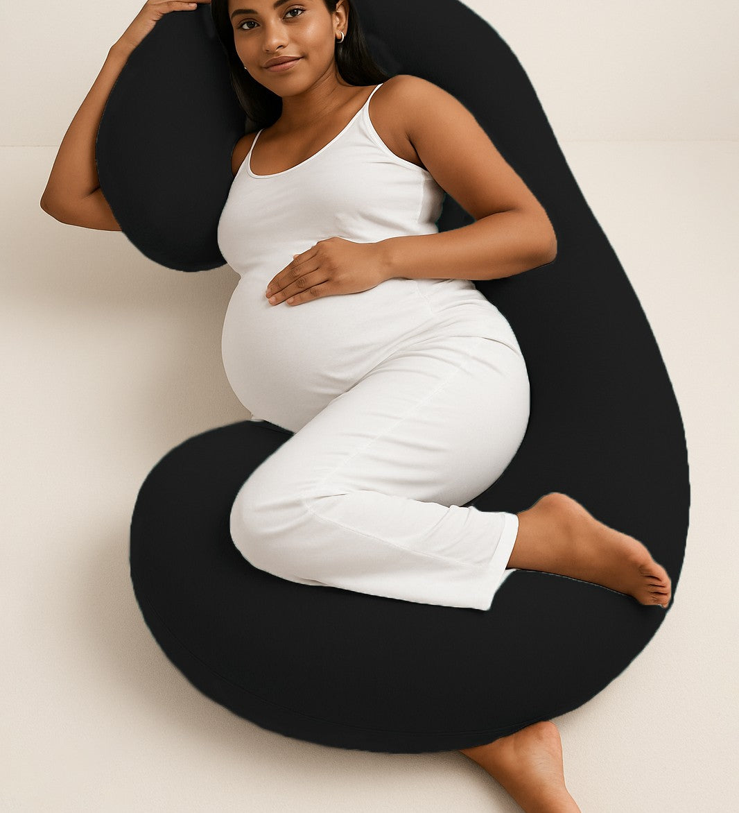ADMIRAE C shape pregnancy pillow in black supporting pregnant woman lying on side