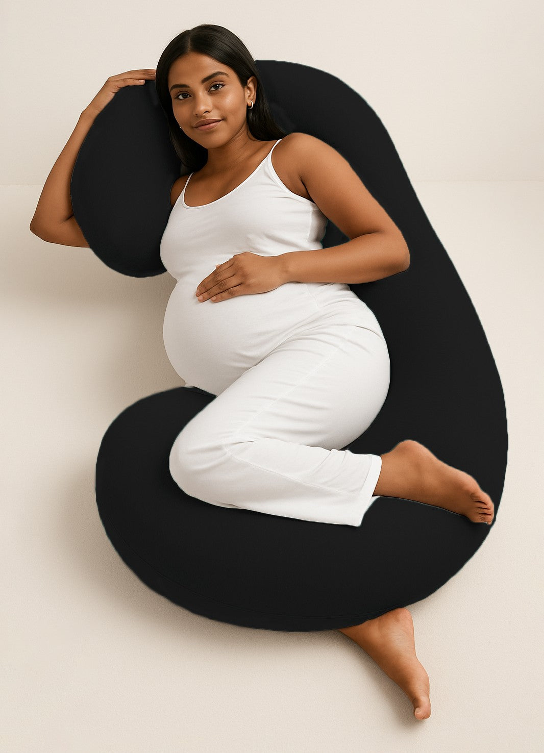 ADMIRAE C shape pregnancy pillow in black supporting pregnant woman lying on side