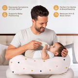 ADMIRAE Feeding Pillow in light design supporting baby while man bottle-feeds infant reducing arm strain