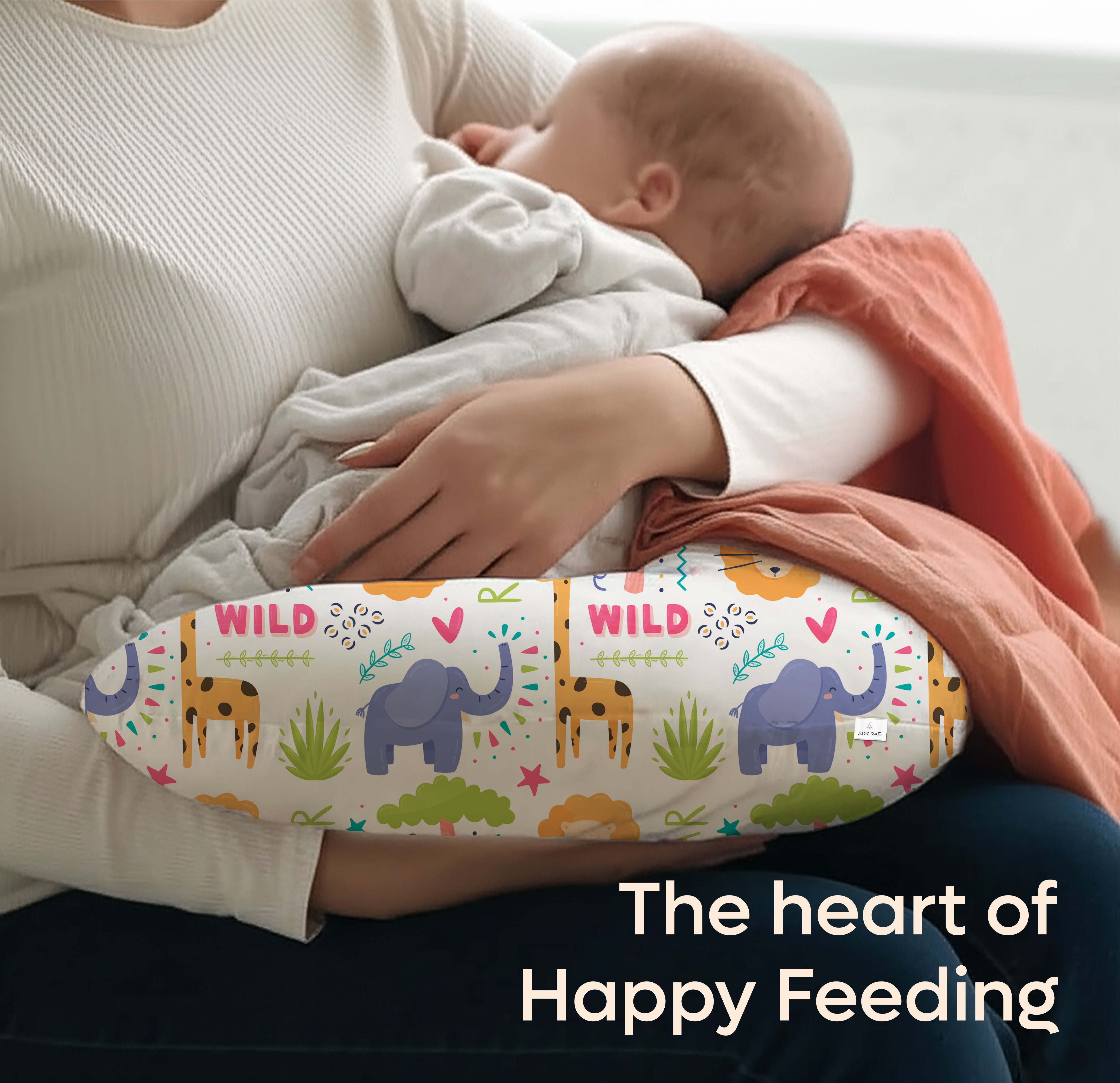 ADMIRAE feeding pillow with colorful animal print supporting baby during breastfeeding