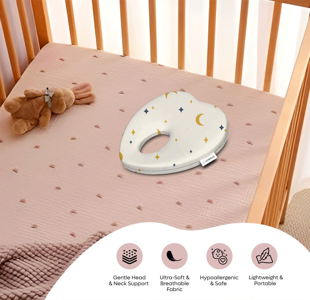 ADMIRAE heart shape baby pillow with gentle head and neck support on crib mattress