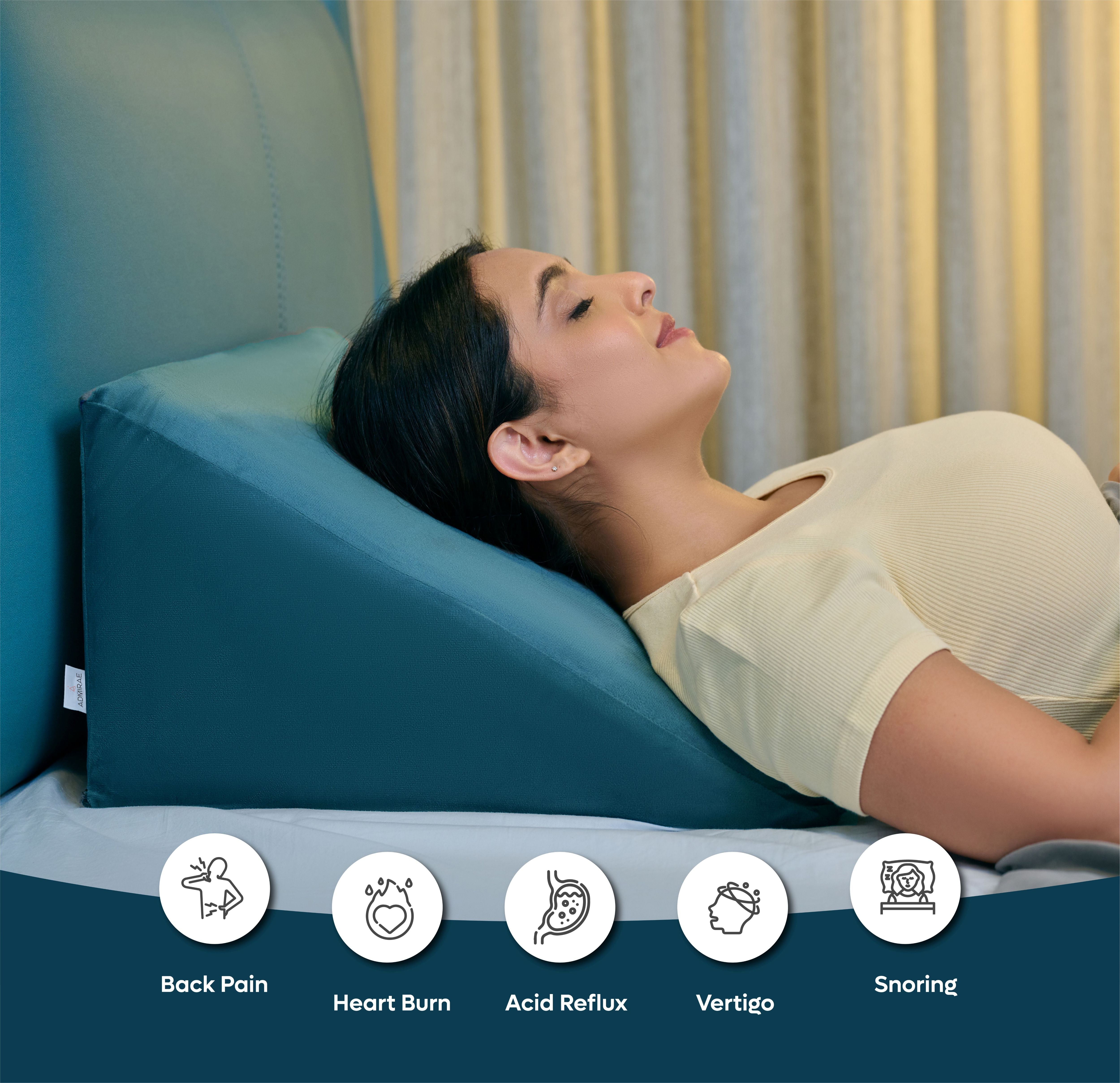 ADMIRAE memory foam wedge cushion in teal supporting a woman reclining to relieve back pain and acid reflux