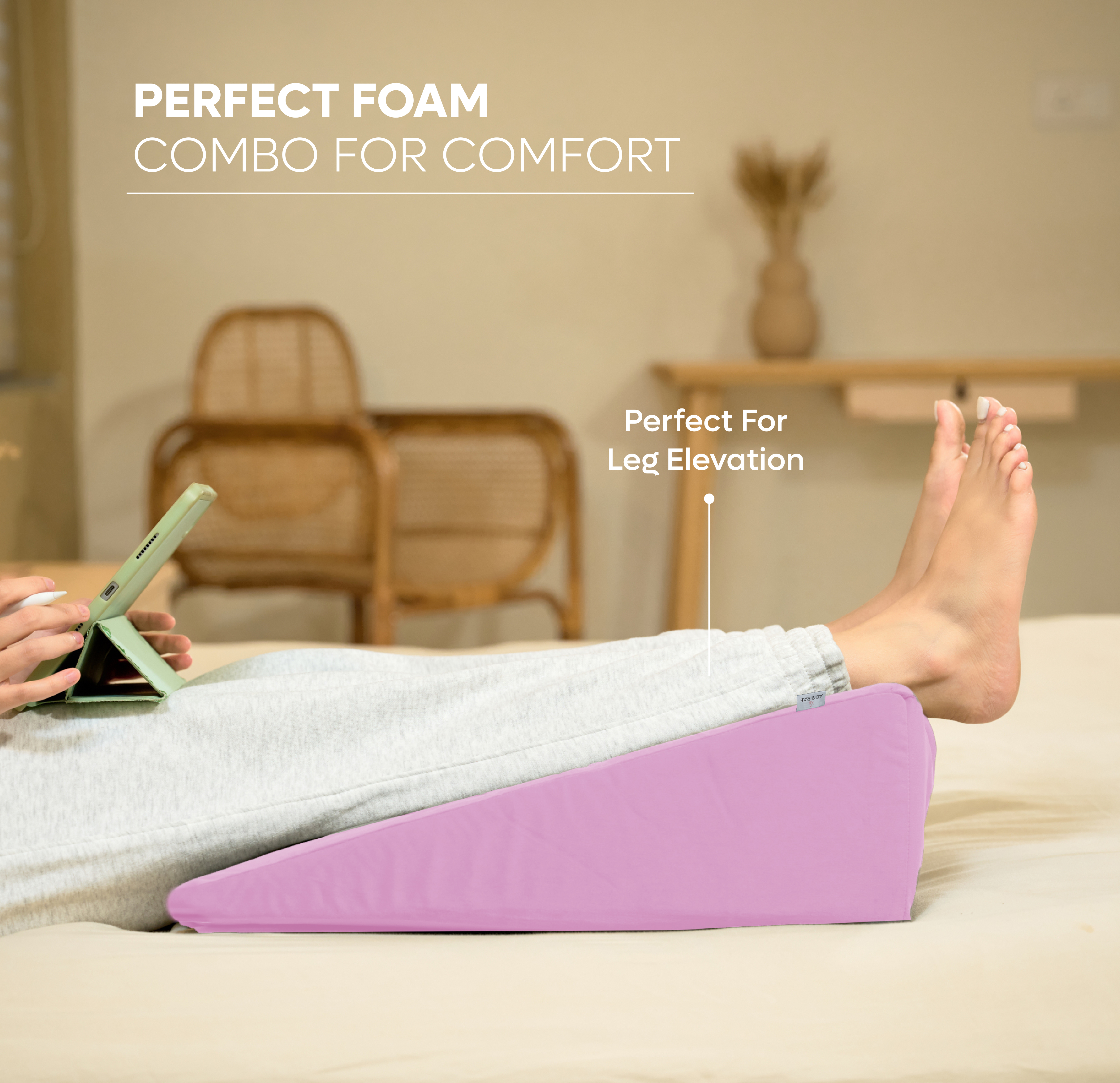 ADMIRAE memory foam wedge cushion in pink used for leg elevation and comfort support