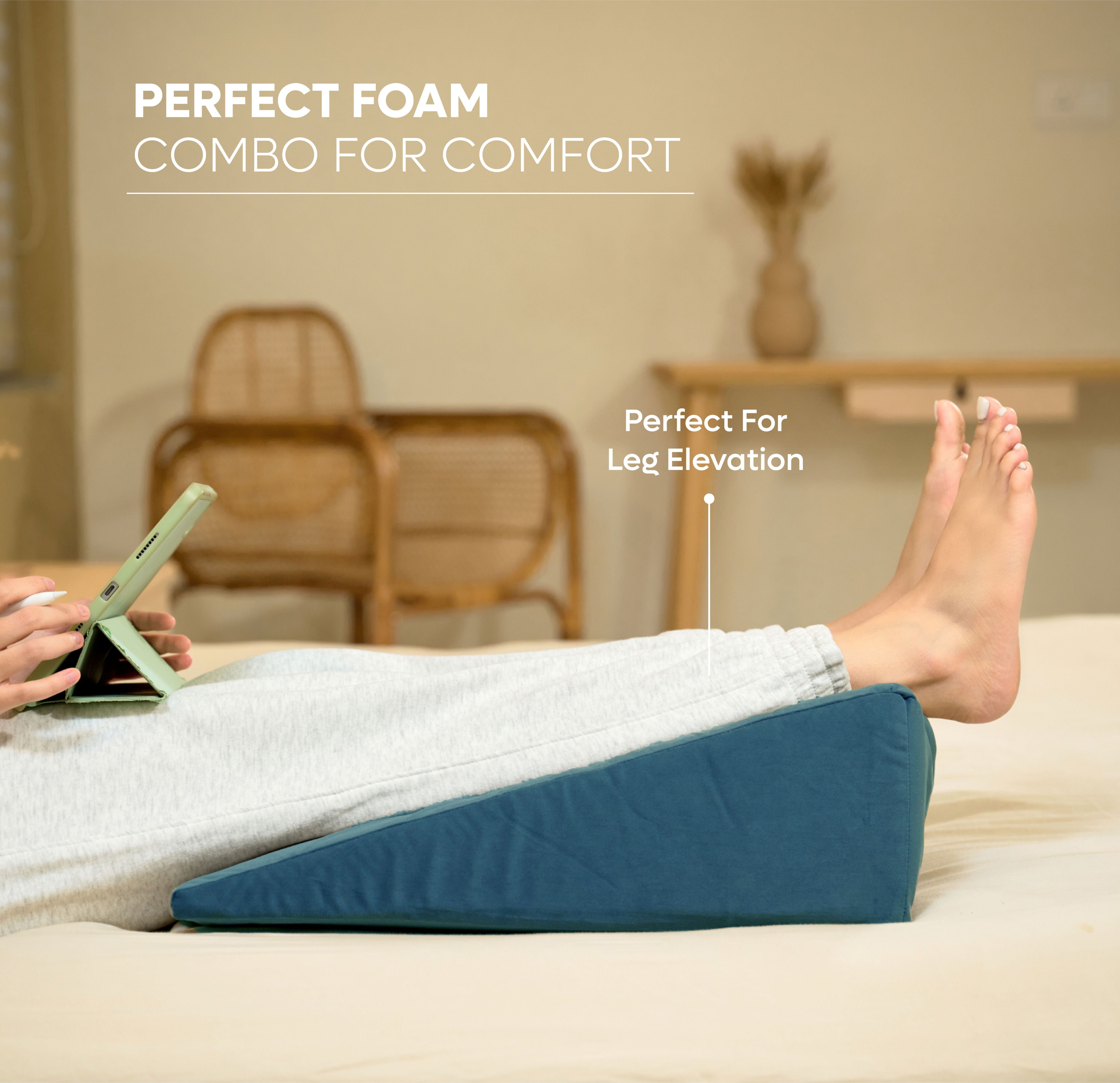ADMIRAE memory foam wedge cushion in blue used for leg elevation and comfort while lying down