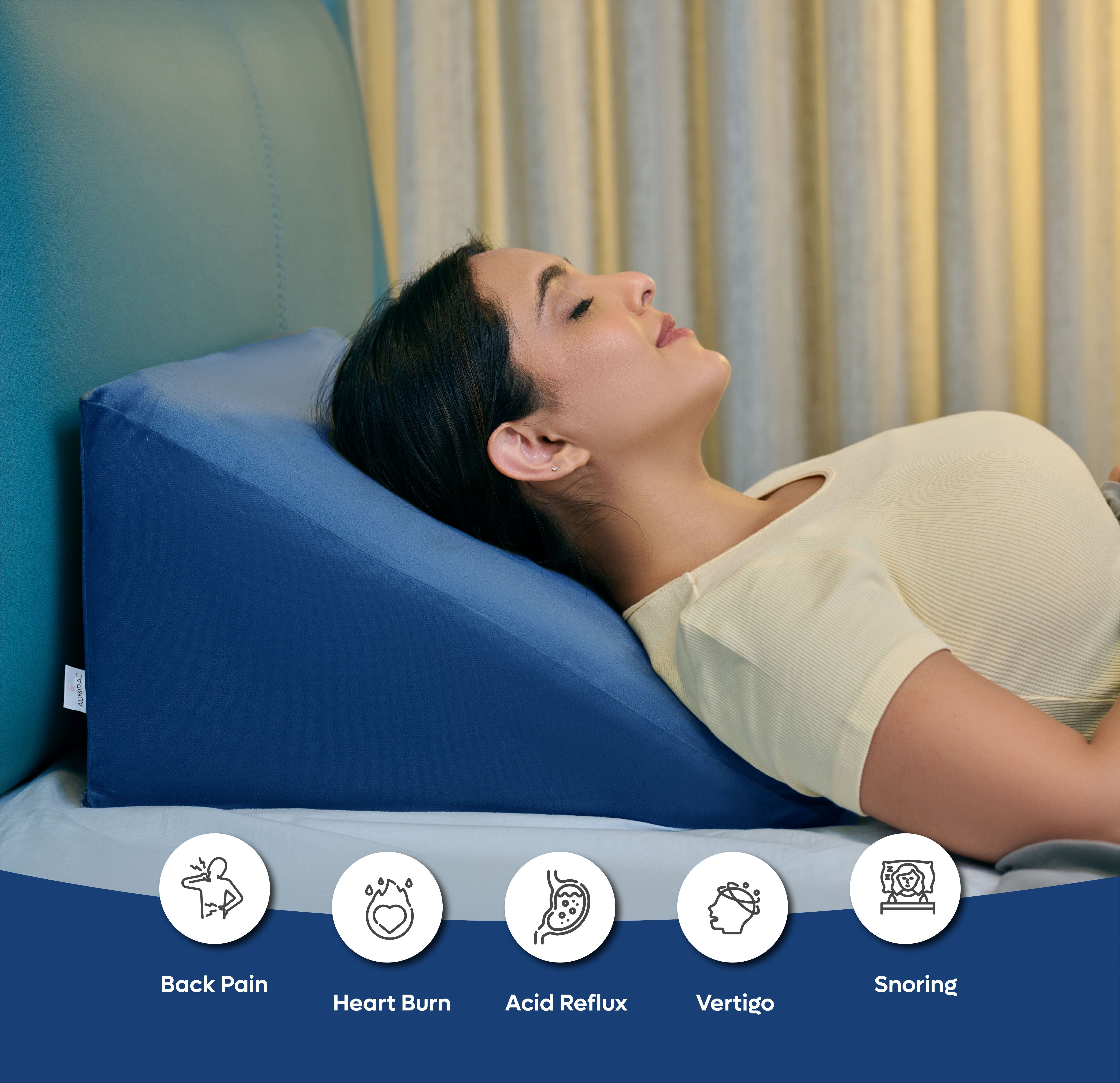 ADMIRAE memory foam wedge pillow in blue supporting a woman reclining for back pain and acid reflux relief