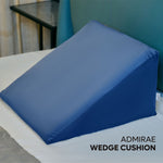 ADMIRAE memory foam wedge pillow in blue on a bed for comfortable support