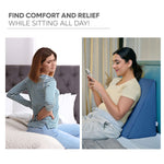 Woman using memory foam wedge pillow for back support while sitting comfortably on bed