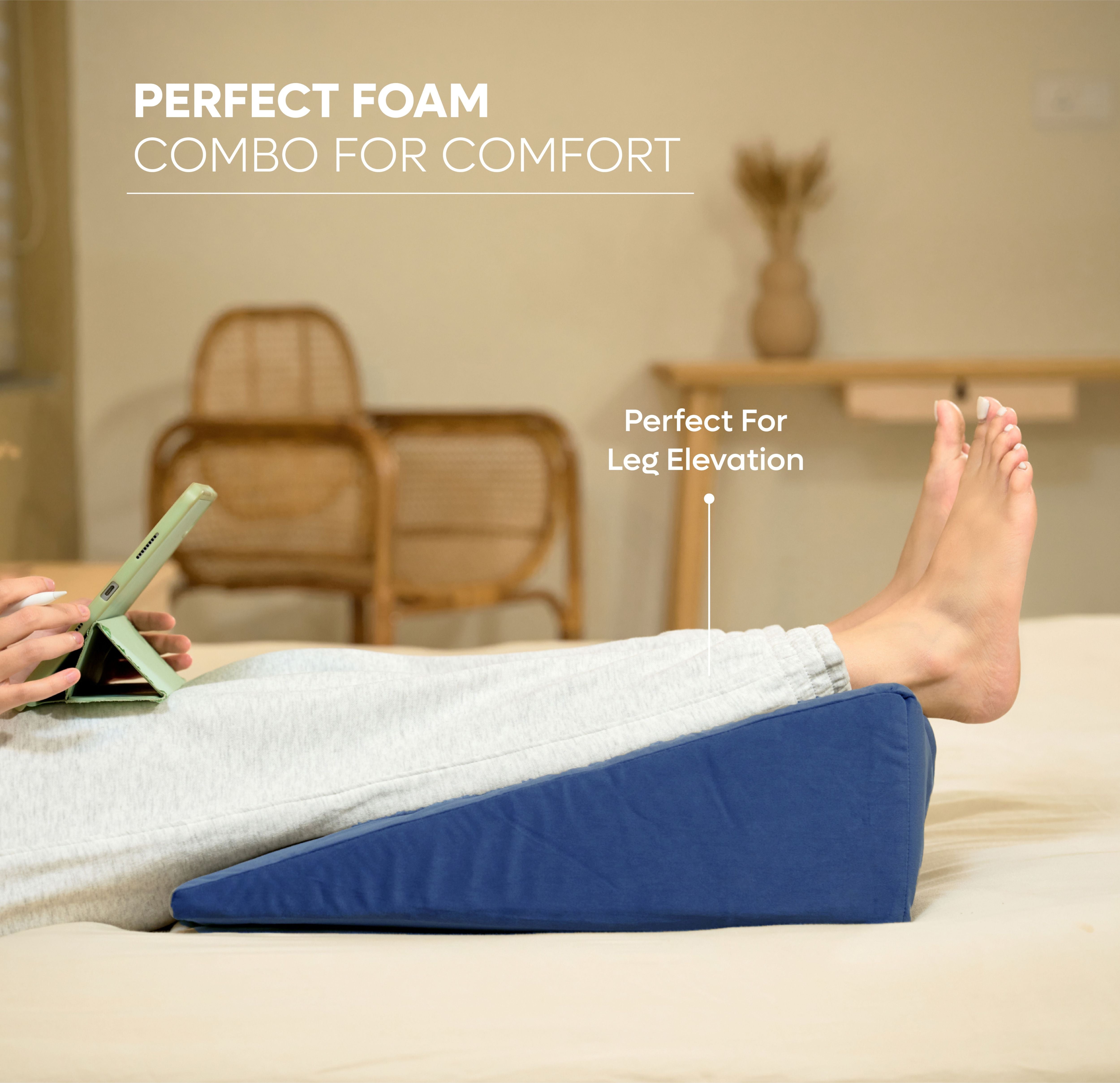 ADMIRAE memory foam wedge pillow in blue supporting elevated legs for comfort and leg elevation