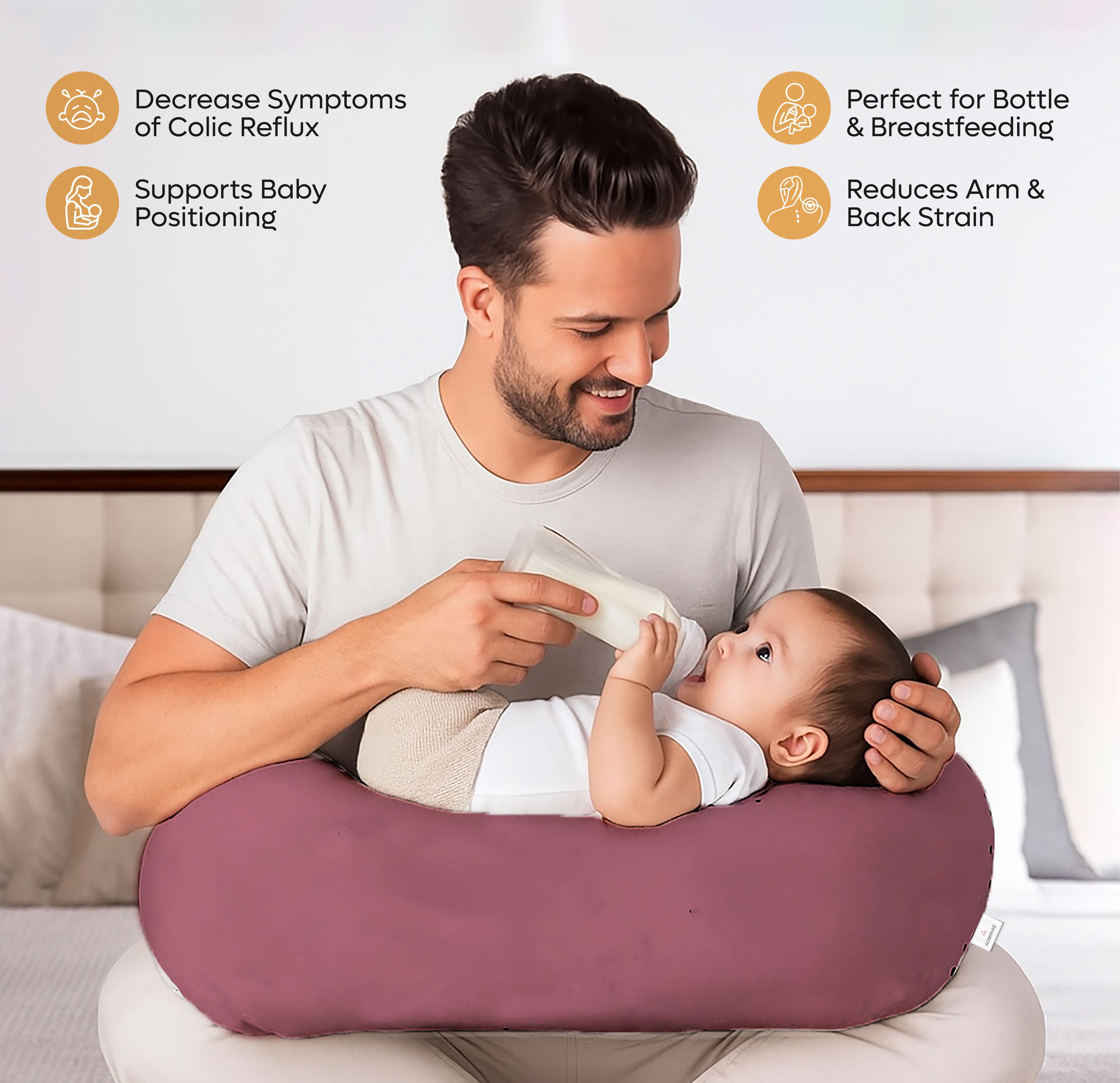 Dad using ADMIRAE Feeding Pillow to bottle feed baby while reducing arm and back strain