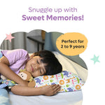 Child sleeping comfortably on colorful memory foam baby pillow with animal prints