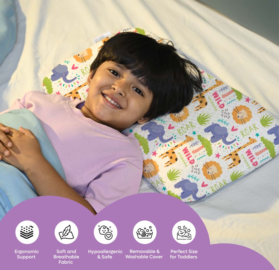 Child lying on a colorful memory foam baby pillow with animal prints providing ergonomic support and comfort