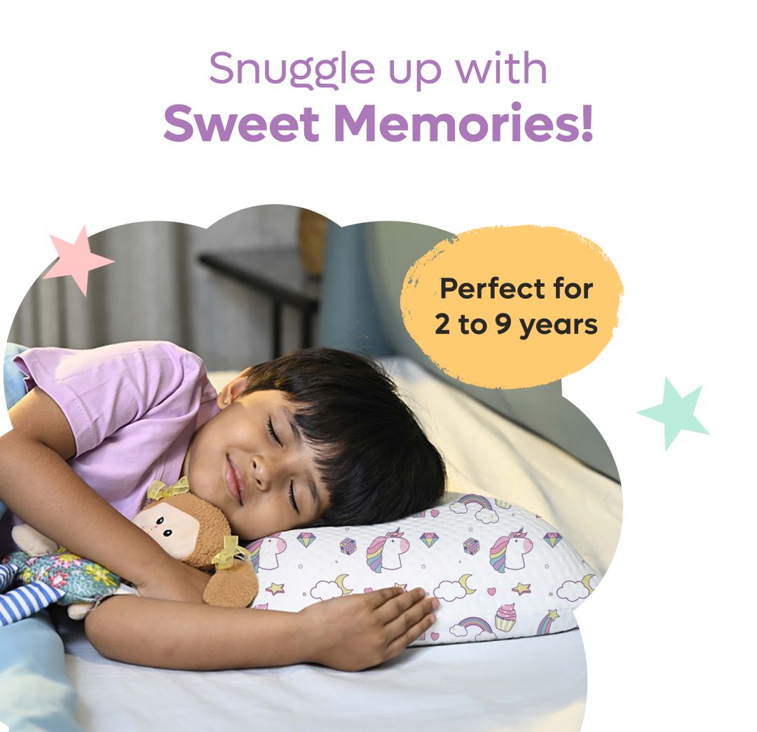 Child sleeping comfortably on a memory foam baby pillow with unicorn prints for ages 2 to 9 years