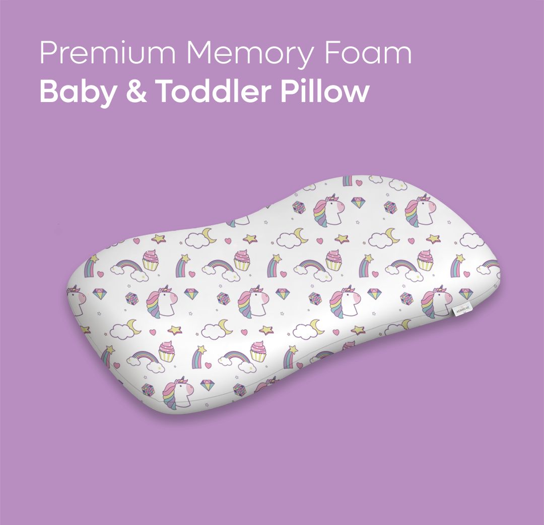 ADMIRAE memory foam baby pillow with unicorn and rainbow print on a purple background